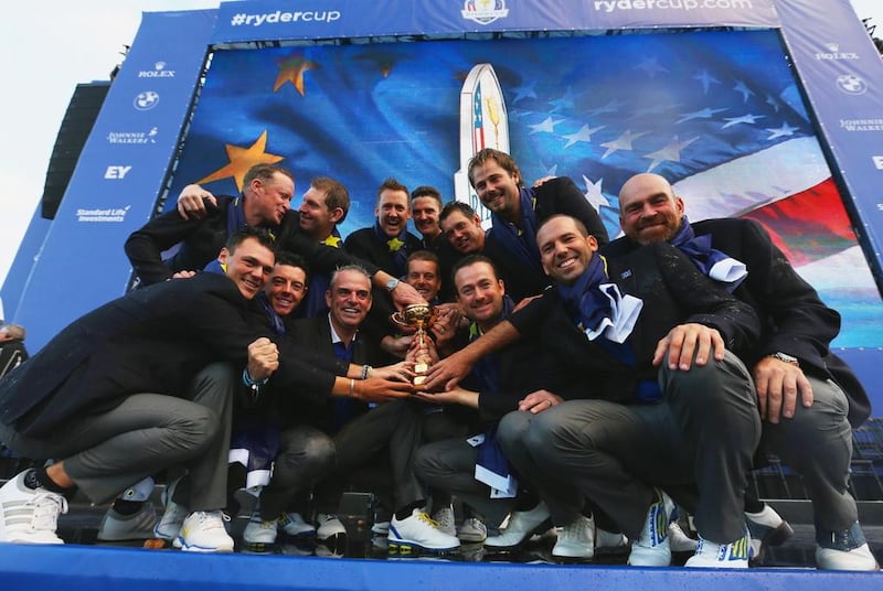 Europe team captain Paul McGinley poses with the Ryder Cup trophy and his team after the 2014 Ryder Cup on the PGA Centenary course at the Gleneagles Hotel on September 28, 2014 in Auchterarder, Scotland. Ross Kinnaird / Getty Images 