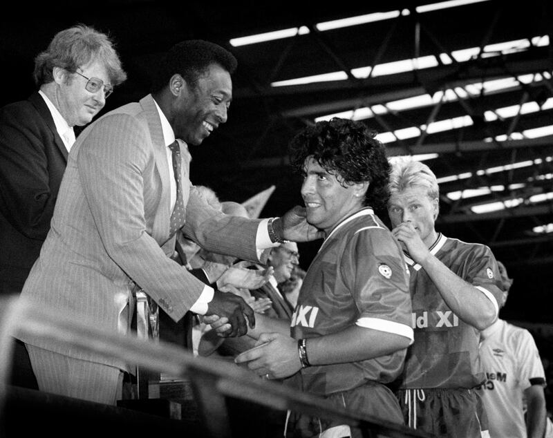 Diego Maradona is greeted by guest of honour Pele after the Centenary Classic at Wembley in London, in August 1987.  Getty Images