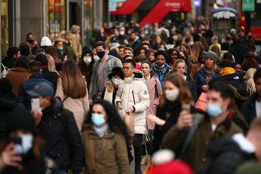 Shoppers walk along a busy Oxford Street in London, England, on December 5, 2020. Shops opened in December in the capital following a November lockdown, before shutting again in the middle of the month, causing an increase in clothing prices. Getty