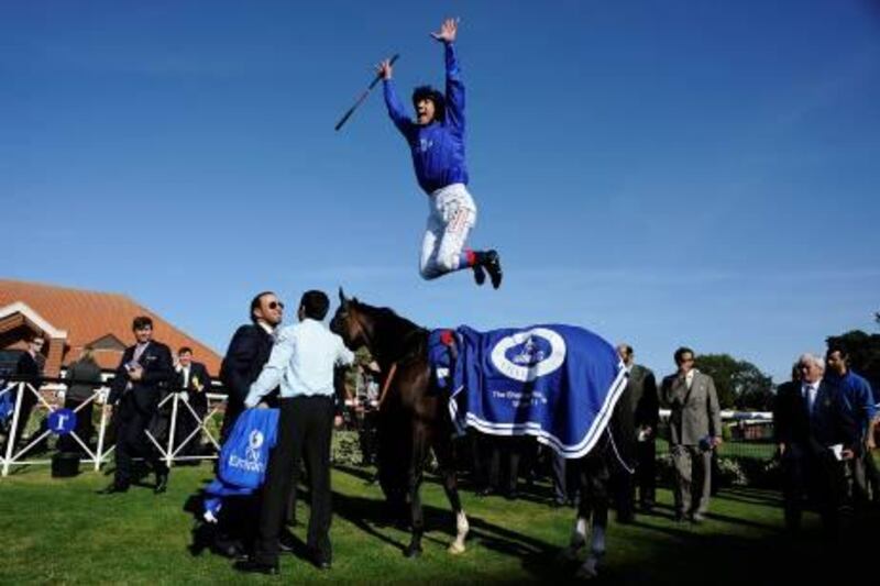 NEWMARKET, ENGLAND - SEPTEMBER 23:  Frankie Dettori leaps off Lyric Of Light as he celebrates winning The Shadwell Fillies' Mile at Newmarket racecourse on September 23, 2011 in Newmarket, England. (Photo by Alan Crowhurst/Getty Images) *** Local Caption ***  126189149.jpg
