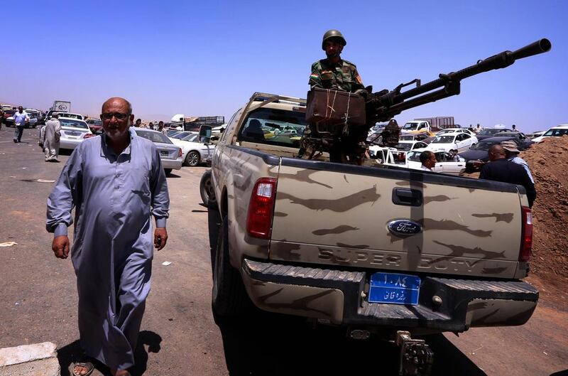 Iraqi police, military and security officials said the insurgents, armed with anti-aircraft weapons and rocket-propelled grenades, had taken over almost all police and army checkpoints in and around Mosul early on Tuesday. Safin Hamed/AFP Photo