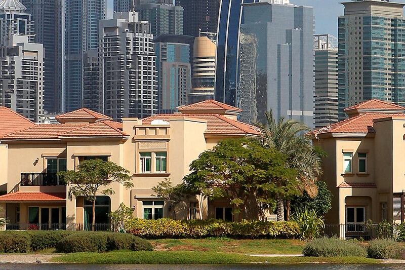 Villas in the Jumeirah Island in Dubai. Jumeirah Lake Towers are also seen in background. Keren Bobker explains the situation with property-related visas. Pawan Singh / The National 