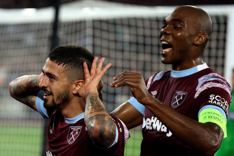 West Ham's Manuel Lanzini celebrates with West Ham's Angelo Ogbonna, right, after scoring his sides first goal during the Europa Conference League Group B soccer match between West Ham United and Silkeborg at the London stadium in London, England, Thursday, Oct.  27, 2022.  (AP Photo / Ian Walton)