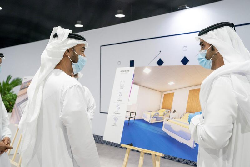 ABU DHABI, UNITED ARAB EMIRATES - May 18, 2020: HH Sheikh Mohamed bin Zayed Al Nahyan, Crown Prince of Abu Dhabi and Deputy Supreme Commander of the UAE Armed Forces (L) visits Emirates Field Hospital, at Emirates Humanitarian City. 

( Mohamed Al Hammadi / Ministry of Presidential Affairs )
---