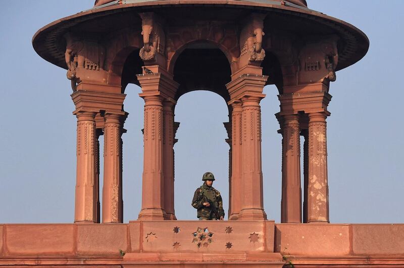 A member of Indian security personnel stands outside the Defence Ministry in New Delhi. AFP
