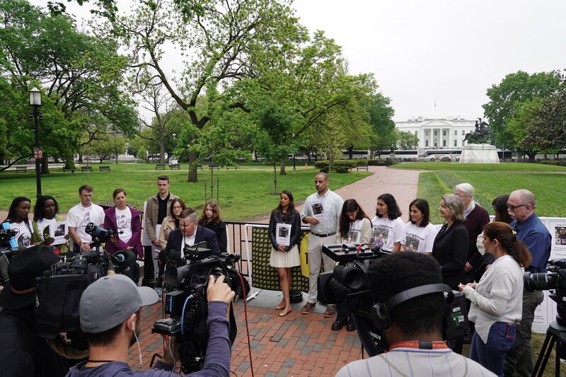 The families of Americans illegally detained abroad gather in front of the White House. 