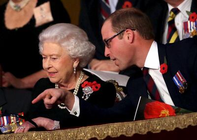 Queen Elizabeth II wearing the Bahrani pearl earrings, with Prince William at the annual Festival of Remembrance in November 2015. Reuters 