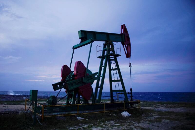 An oil pump works near the sea in Boca de Jaruco, Cuba, September 23, 2019. REUTERS/Alexandre Meneghini