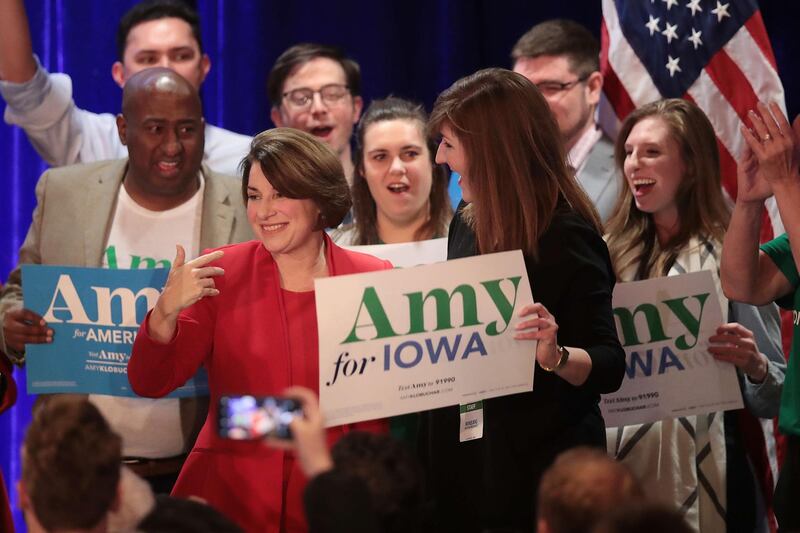Democratic presidential candidate Amy Klobuchar greets supporters at her caucus night watch party before results come in in Des Moines, Iowa. AFP