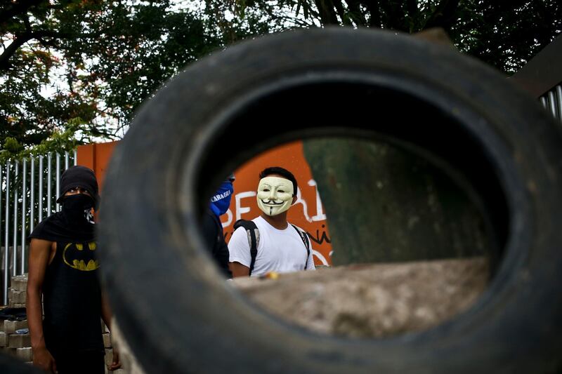 Demonstrators man a barricade placed in front a National Agrarian University during a protest against Nicaragua's President Daniel Ortega in Managua, Nicaragua. Esteban Felix / AP Photo