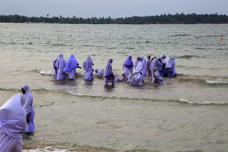 Muslim girls bathing in their clothes, Pasikudah Bay, Eastern Province, Sri Lanka, Asia. (Photo by: GeographyPhotos/Universal Images Group via Getty Images)