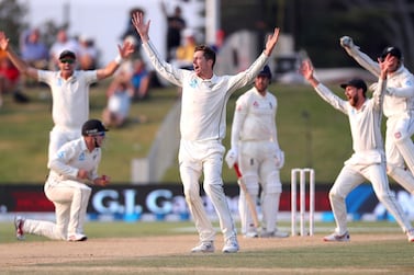Mitchell Santner appeals successfully after teammate Tom Latham (L) took a catch to dismiss England's Jack Leach during the fourth day of the first Test between England and New Zealand at Bay Oval. AFP