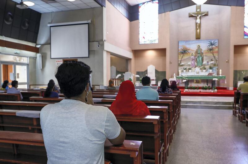 Abu Dhabi, United Arab Emirates, August 25, 2020.   Social distancing and other Covid-19 measures are adhered to at the St. Joseph's Catholic Church in Abu Dhabi.  Two people per pew is observed.Victor Besa /The NationalSection:  NAReporter:  Ramola Talwar