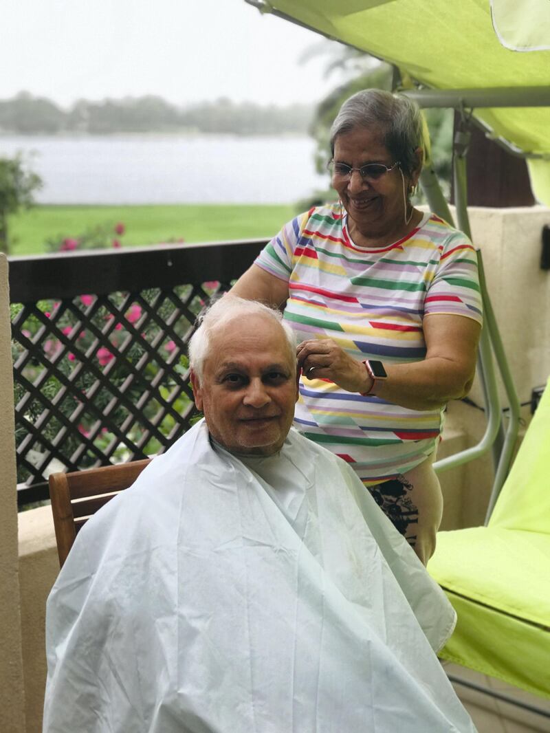 A touching UAE moment captured by a photographer depicting her mother cutting her father's hair. "I found this moment filled with hope. It was lovely to see my parents taking care of each other," the photographer says. Courtesy of Mahima Mehta