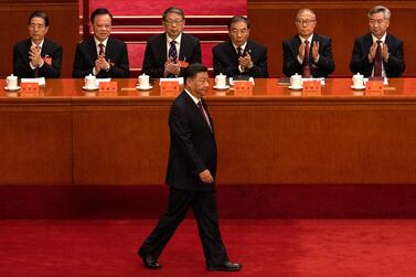 BEIJING, CHINA - OCTOBER 16: Chinese President Xi Jinping is applauded by senior members of the government as he walks on stage before his speech to the Opening Ceremony of the 20th National Congress of the Communist Party of China  at The Great Hall of People on October 16, 2022 in Beijing, China. Xi Jinping is widely expected to secure a third term in power. (Photo by Kevin Frayer / Getty Images)