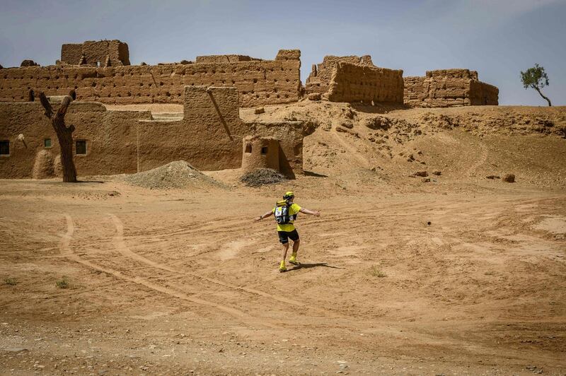 A man competes in the stage 3 of the 34rd edition of the Marathon des Sables, between Kourci Dial Zaid and Jebel El Mraïer in the southern Moroccan Sahara desert.  AFP