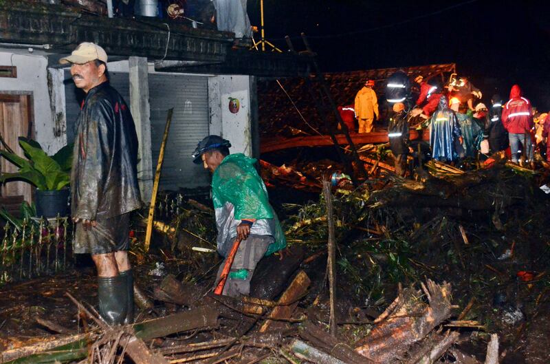 Relief efforts were hampered by blocked roads covered with thick mud and debris. AP Photo