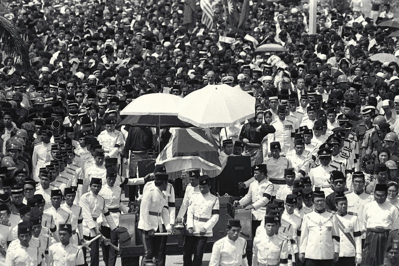 Funeral of the late Malaysian Prime Minister Tun Abdul Razak outside Parliament House, Kuala Lumpur. The gun carriage bearing the casket of the late Premier, surrounded by a sea of mourners, leaving Parliament House for the burial at National Mosque. Tun Razak died in London clinic while undergoing treatment for chronic leukaemia.(Singapore Press via AP Images).