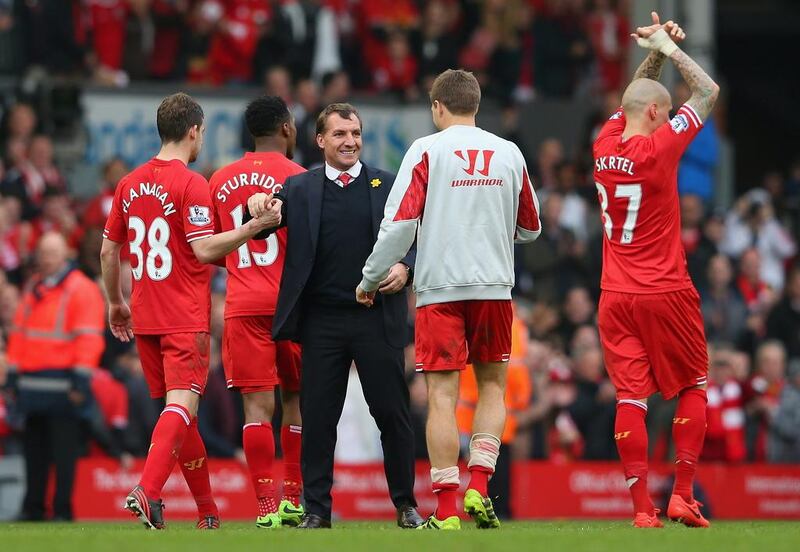 Liverpool manager Brendan Rodgers, Jon Flanagan and Steven Gerrard will need some help for a chance at the English Premier League title. Alex Livesey/Getty Images