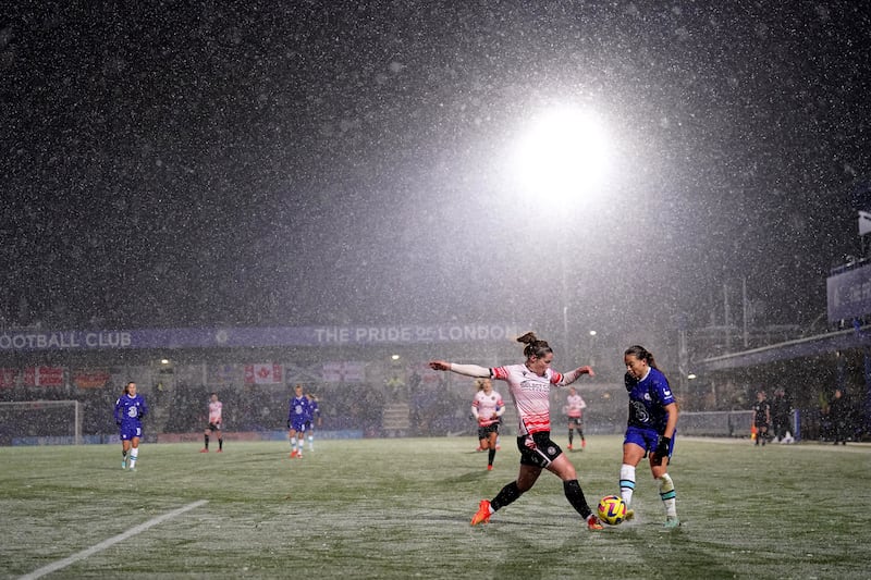 Chelsea and Reading players brave wintry conditions for their Women's Super League match at Kingsmeadow, south-west London. Chelsea won 3-2. PA