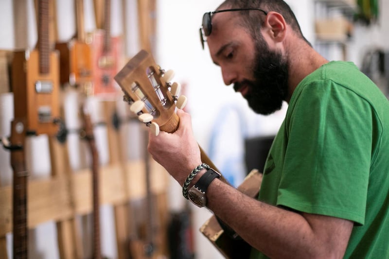 DUBAI, UNITED ARAB EMIRATES - May 30 2019.

Howlin' Rooster workshop specializes in building and customizing various stringed instruments. It is currently located in KAVE, The Story of Things, an upcycling cafe concept in Al Serkal avenue.

The space offers different workshops that take place weekly, including guitar making, embroidery lessons, meditation sessions, bottle cutting workshops and chaircycling rides.

(Photo by Reem Mohammed/The National)

Reporter: 
Section: WK
