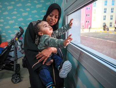 One-year-old Rakan Saif, pictured with grandmother Manal Abdulla. 
Victor Besa / The National