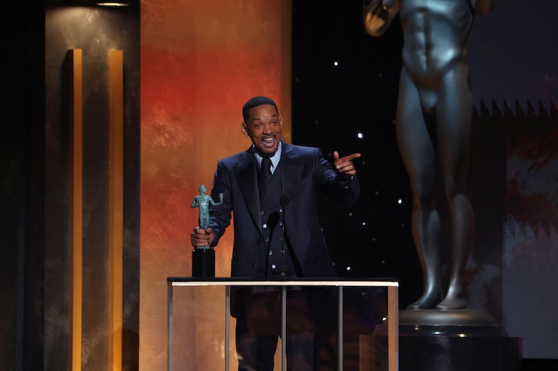 Will Smith receives the award for Outstanding Performance by a Male Actor in a Leading Role for 'King Richard'. Reuters