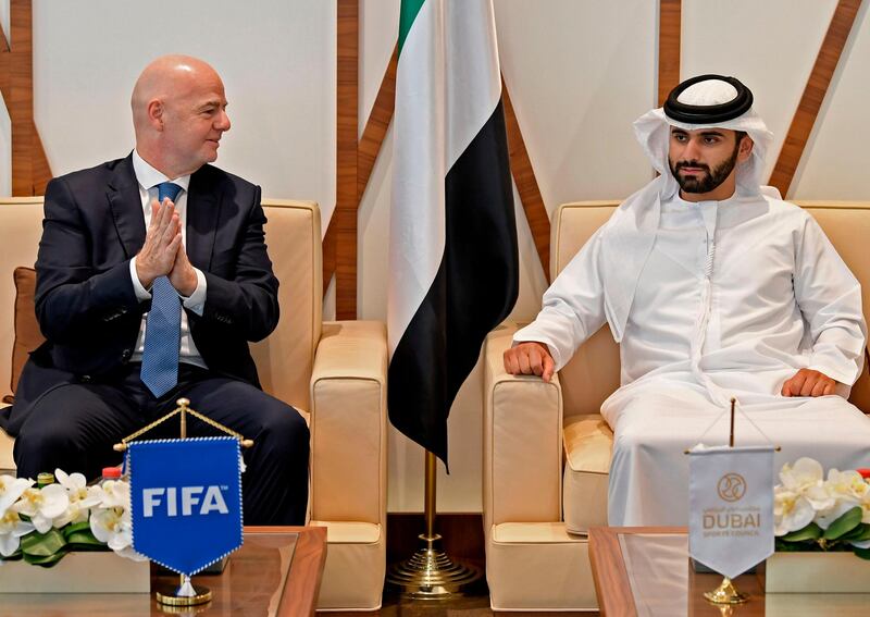 Sheikh Mansour bin Mohammed bin Rashid, right, and Fifa President Gianni Infantino in Dubai. AFP