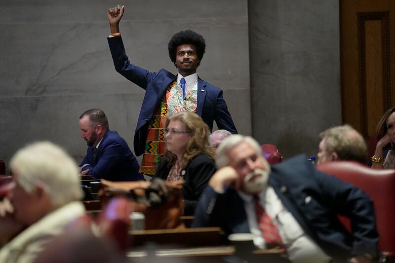 Memphis representative Justin J. Pearson raises his fist to acknowledge people in the gallery during a special session of the Tennessee state legislature. AP
