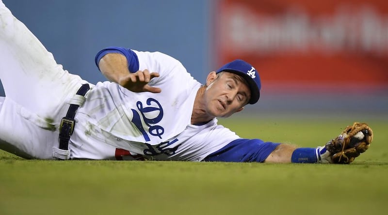 Los Angeles Dodgers second baseman Chase Utley dives for a ball hit by Chicago Cubs’ Ben Zobrist during the fifth inning of a baseball game in Los Angeles. Mark J Terrill / AP Photo