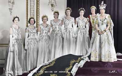 HM Queen Elizabeth II with her maids of honour, Green Drawing Room, Buckingham palace, 2nd June 1953. In selecting six Maids of Honour instead of pages to bear her velvet train throughout the Coronation ceremony, the Queen followed the precedent of Queen Victoria. Lady Moyra Hamilton (now Lady Moyra Campbell), Lady Anne Coke (now The Rt Hon The Lady Glenconner), Lady Rosemary Spencer-Churchill (now Lady Rosemary Muir), Lady Mary Baillie-Hamilton (now Lady Mary Russell), Lady Jane Heathcote-Drummond-Willoughby (now The Rt Hon The Baroness Willoughby de Eresby), Lady Jane Vane-Tempest-Stewart (now The Rt Hon The Lady Rayne). (Colorised black and white print). Artist Cecil Beaton. (Photo by The Print Collector/Getty Images)