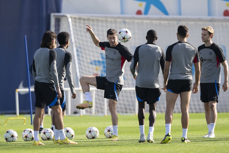 Barcelona's Robert Lewandowski takes part in a training session with teammates on the eve of the Champions League match against Bayern Munich. EPA