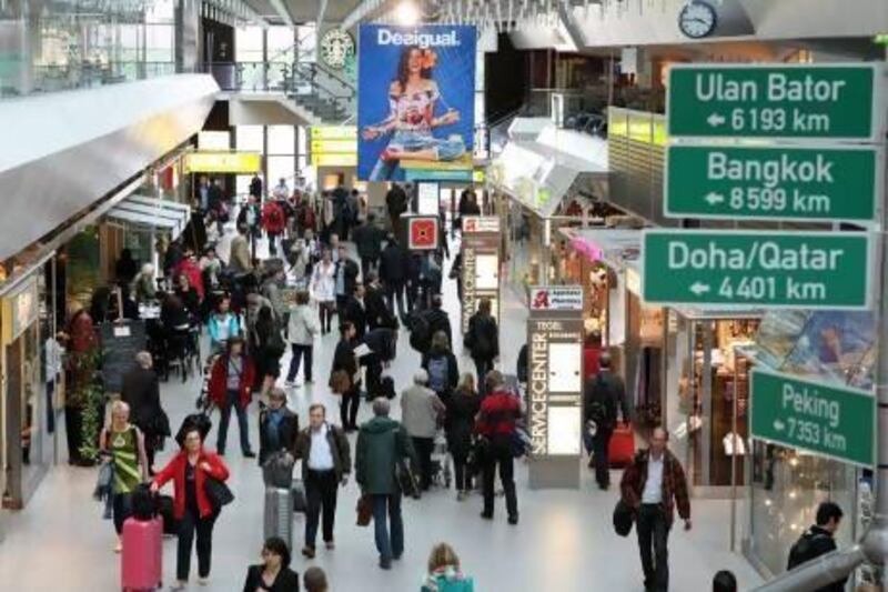 Passengers walk through Berlin's Tegel airport. The International Air Transport Association will open its annual general meeting in Cape Town, South Africa, today. Adam Berry / Getty Images