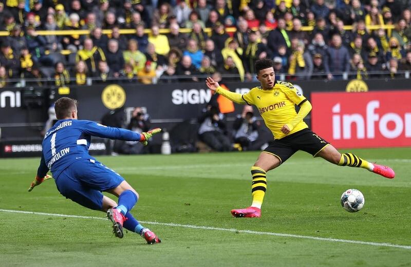 Borussia Dortmund's Jadon Sancho scores the winner against Freiburg . Getty