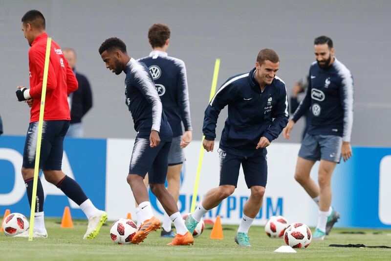 France's Antoine Griezmann smiles as he warms up during a training session at the 2018 soccer World Cup in Glebovets, Russia, Wednesday, July 4, 2018. (AP Photo/David Vincent)