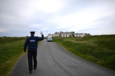 A member of An Garda Siochana (Irish Police officer) stops traffic at U.S. President Donald Trump's Doonbeg golf course for security checks ahead of an upcoming visit to his golf course in the County Clare village of Doonbeg, Ireland, May 28, 2019. Picture taken May 28, 2019. REUTERS/Clodagh Kilcoyne