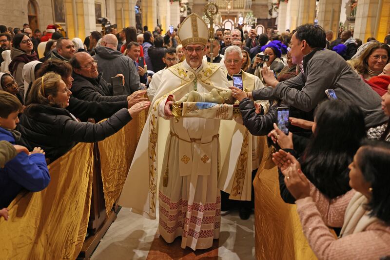 Archbishop Pierbattista Pizzaballa leads Mass at Saint Catherine's Church in the Palestinian city of Bethlehem. Reuters