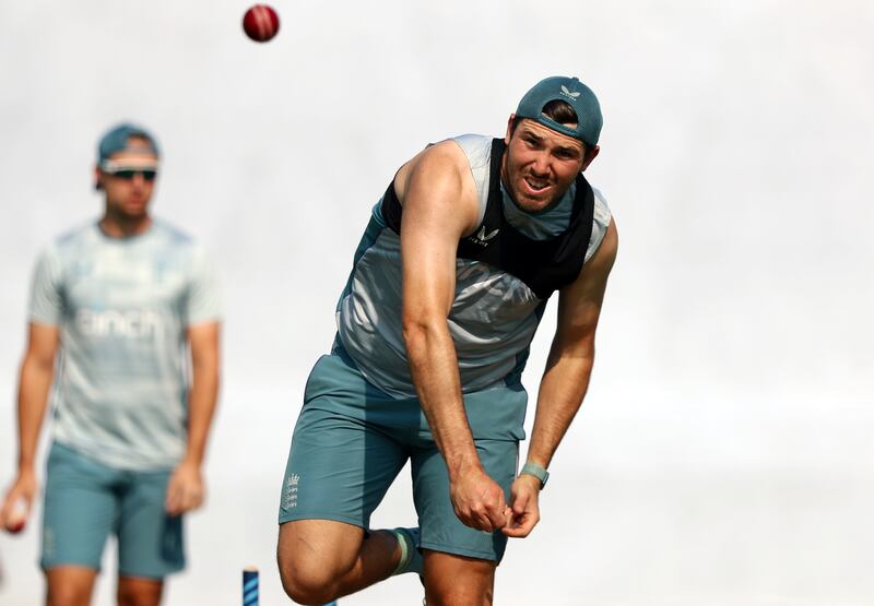 England's Jamie Overton bowls during training