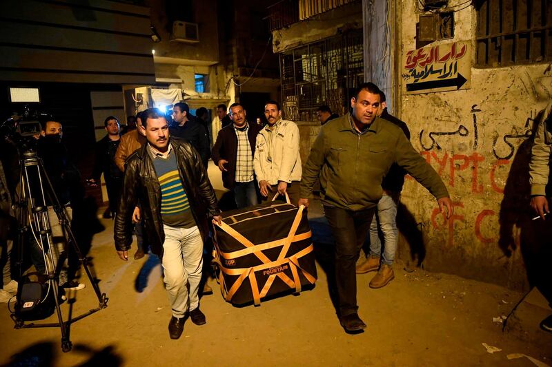 Egyptian police carry equipment to the site of the explosion. AFP