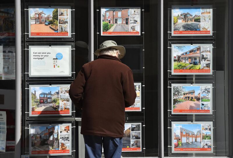 NEWCASTLE-UNDER-LYME, ENGLAND- MAY 12: : A man is seen looking at houses for sale at an estate agents on May 12, 2021 in Newcastle-Under-Lyme, England . (Photo by Nathan Stirk/Getty Images)