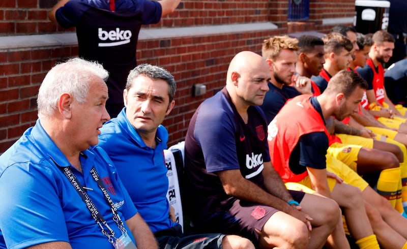 Ernesto Valverde, second left, watches his Barcelona side in action. AFP