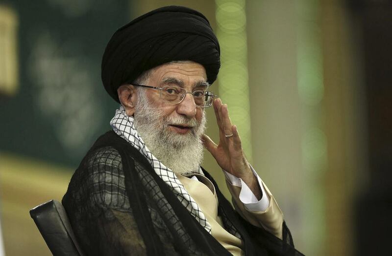 Iran's supreme leader Ayatollah Ali Khamenei waves during a meeting in Tehran, Iran on September 7, 2014. Office of the Supreme Leader/AP Photo