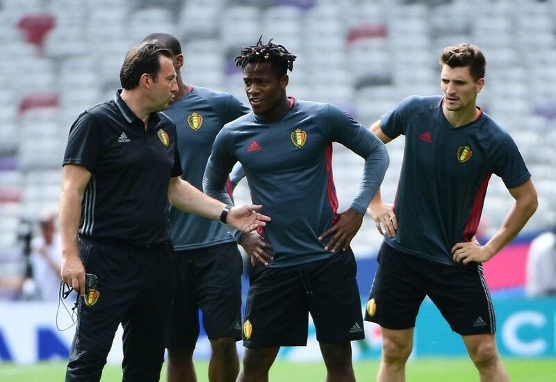 Belgium coach Marc Wilmots (L) speaks with Belgium’s forward Michy Batshuayi (C) and Belgium’s defender Thomas Meunier during a training session at the Stadium Municipal in Toulouse, southern France, on June 25, 2016, on the eve of the Euro 2016 football match between Hungary and Belgium. Emmanuel Dunand / AFP