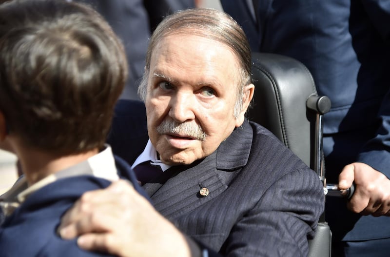 (FILES) In this file photo taken on November 23, 2017, Algerian President Abdelaziz Bouteflika is seen while voting at a polling station in the capital Algiers during polls for local elections.  Algeria's ailing President Abdelaziz Bouteflika will seek a fifth term in April elections, the country's official APS news agency said on February 10. The 81-year-old head of state, in power since 1999, announced his candidacy in a message to the nation sent to the agency, said APS, which will release it later in the day. / AFP / RYAD KRAMDI
