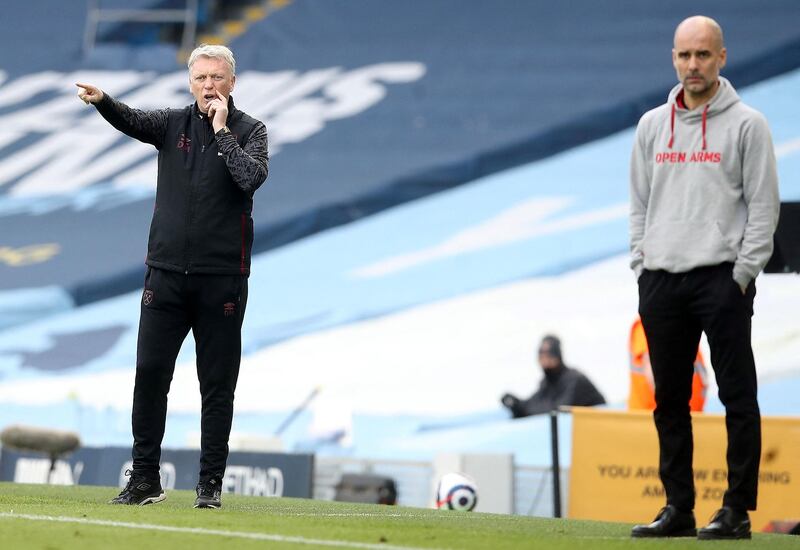 West Ham United's manager David Moyes and Manchester City's boss Pep Guardiola. AFP