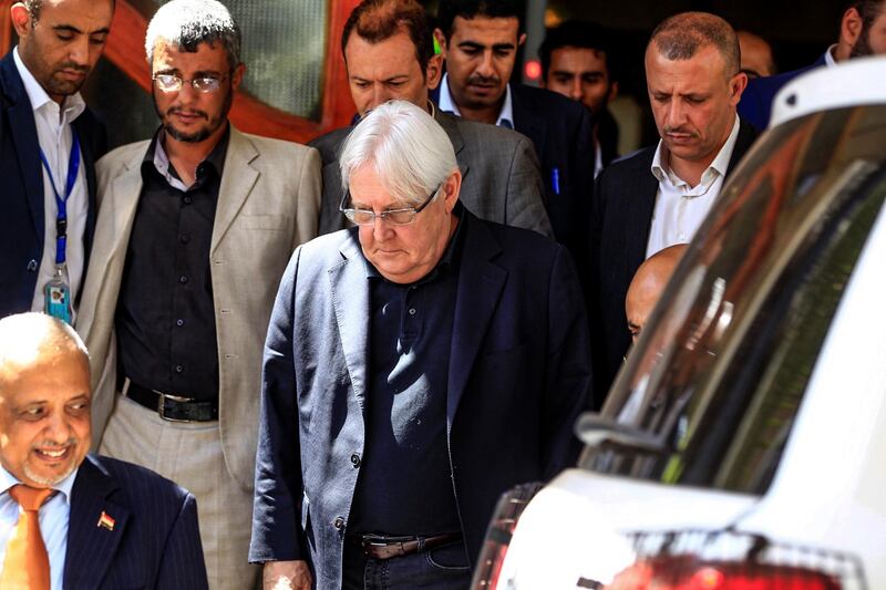 Martin Griffiths (C), the UN special envoy for Yemen, arrives at Sanaa international airport on February 11, 2019.  / AFP / Mohammed HUWAIS
