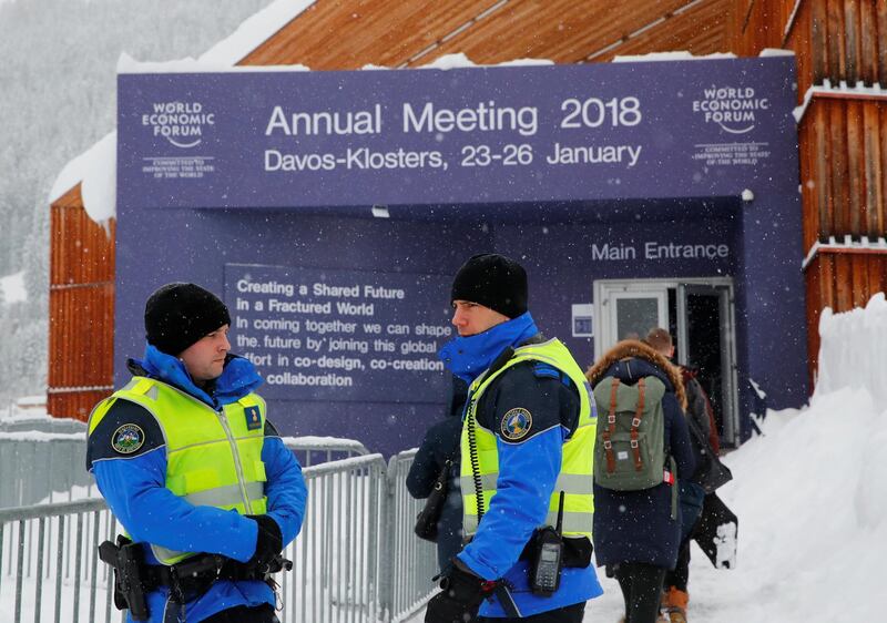 Police officers stand guard in front of the main entrance ahead of the World Economic Forum (WEF) annual meeting in the Swiss Alps resort of Davos. Denis Balibouse / Reuters