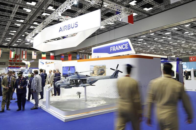 Visitors attend the opening of the Doha International Maritime Defence Exhibition (DIMDEX), in the Qatari capital Doha on March 12, 2018. / AFP PHOTO / KARIM JAAFAR