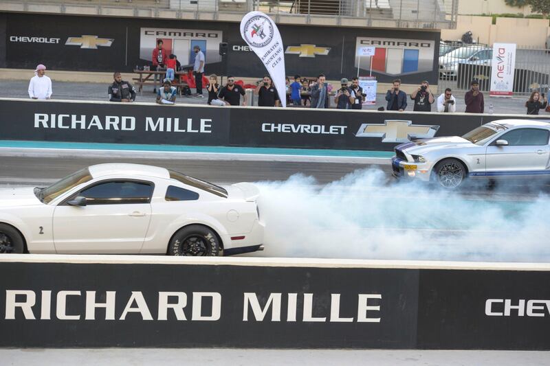 Abu Dhabi, United Arab Emirates - Mustangs burn out at the Drag Race Car Show event sponsored by Premium Motors & organized by Emirates Mustang Club at Yas Marina Circuit on January 29, 2018. (Khushnum Bhandari/ The National)
