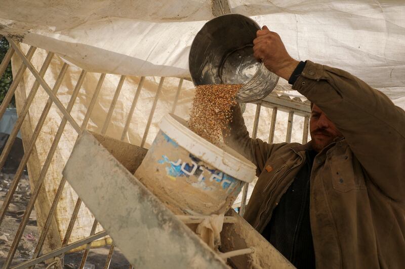 Grain goes into a grinder to make flour for bread in Gaza city, as beleaguered Palestinians become increasingly desperate for food. AFP